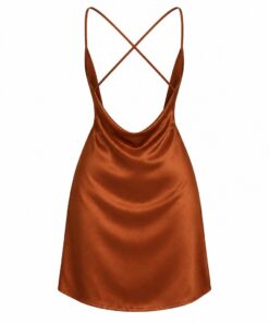 Back view of rust satin backless mini dress with crossed straps, on white